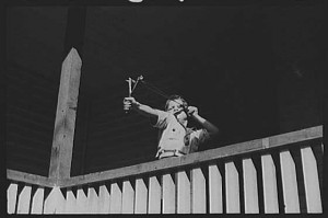 Mountain-child-shooting-slingshot-from-porch-of-his-home.-Near...-painting-artwork-print